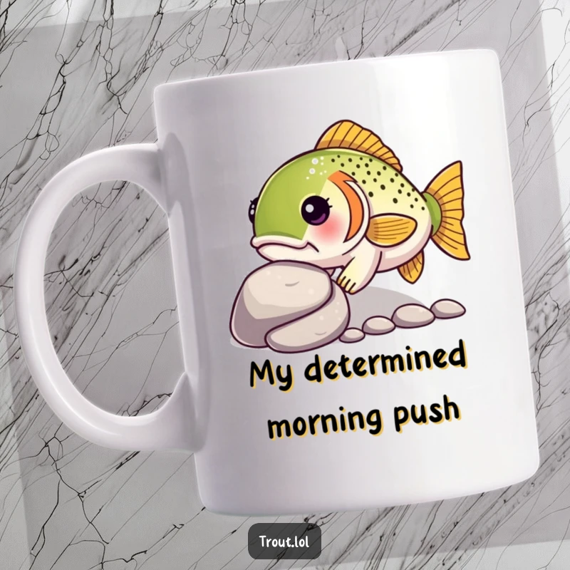 Funny mug featuring a determined kawaii trout with a focused expression, gently nudging a smooth pebble along the riverbed.