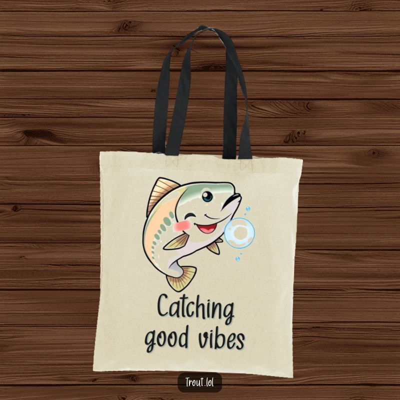 Funny tote bag illustrating a trout with a joyful grin, playfully chasing a single, reflective shimmering bubble.