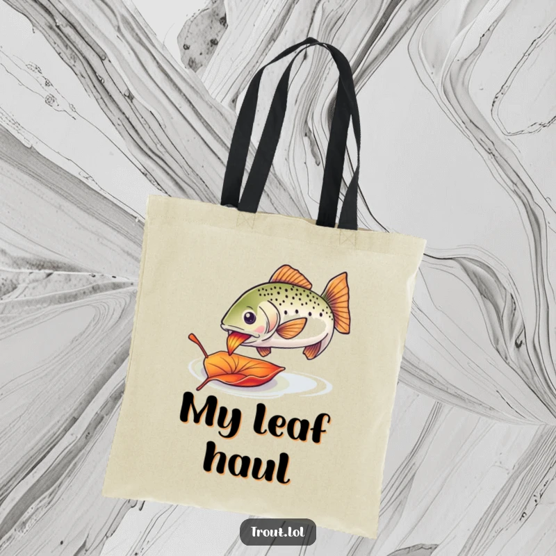 Funny trout leaf tote bag featuring an enthusiastic trout nibbling on a colorful drifting leaf, great for everyday use.
