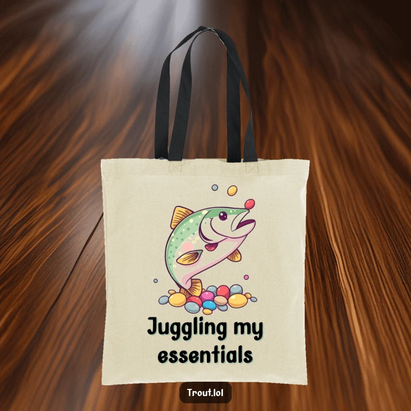 Funny tote bag with a trout juggling colorful pebbles using its fins, ideal for carrying items with a humorous, skillful touch.